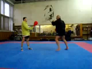 koi. paired practice of mawashi geri with a clapperboard